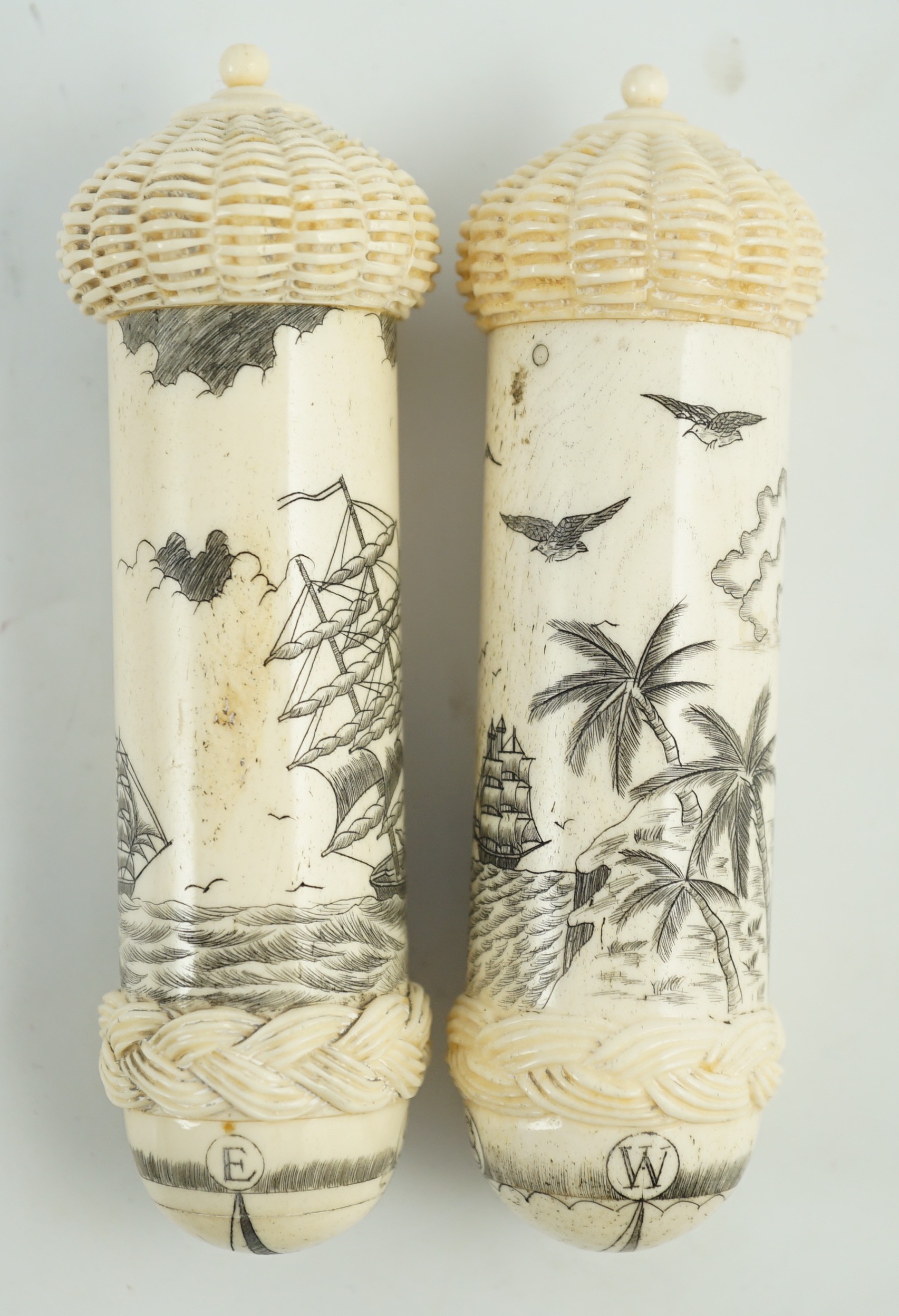 Two bone scrimshaw needle cases, 12cms high